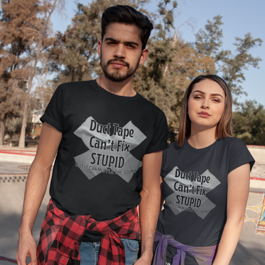 Shown is a couple wearing our 'Duct Tape Can't Fix Stupid, But It Can Muffle the Sound' unisex t-shirt. This funny t-shirt features a bold graphic of duct tape. One is wearing it on a short sleeve Black T-shirt and the other is wearing it on a dark grey tee.